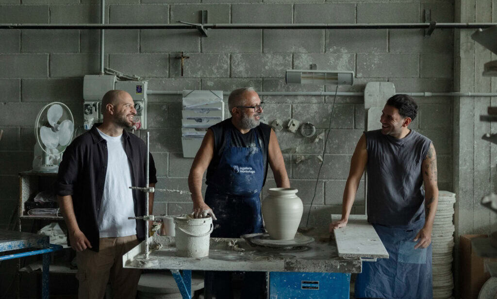 Ceramic artisans collaborating during a Florence pottery experience at La Galleria.