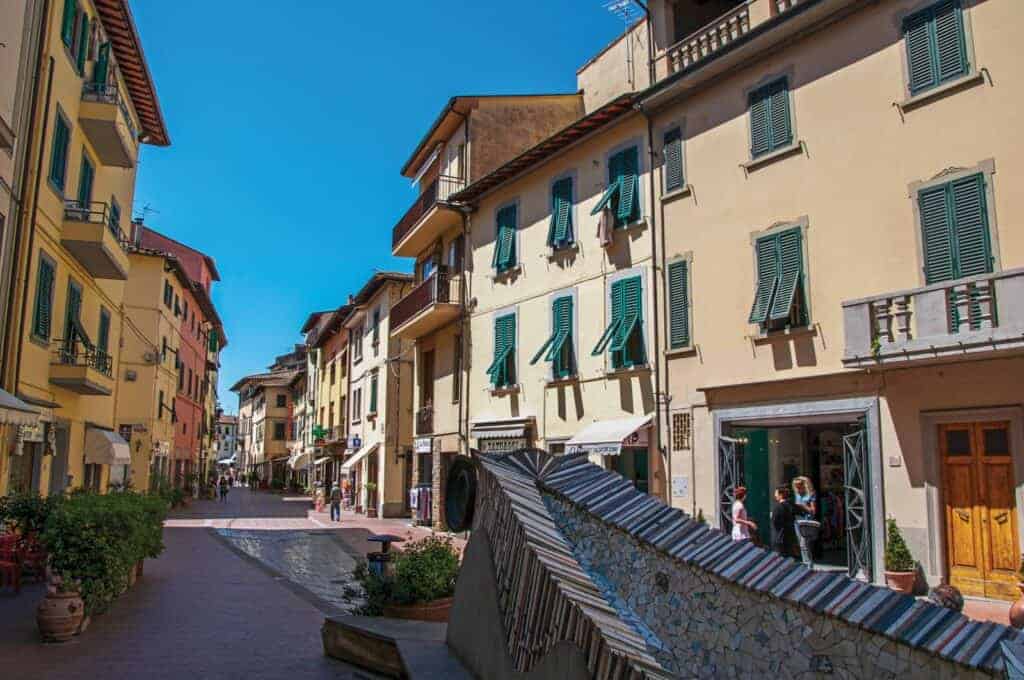 Florence Pottery Experience by La Galleria, showcasing traditional ceramics in a charming street sce.